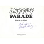 Charles Schulz signed Snoopy Parade hardback book. Signed on inside title page. Good Condition.