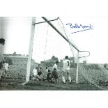 Autographed BOB MONCUR photo, a superb image depicting Moncur scoring for Newcastle United in a 3