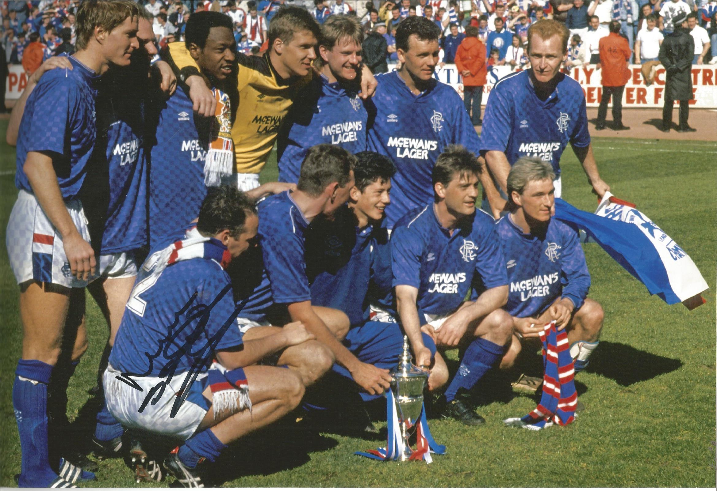 Autographed MEL STERLAND photo, a superb image depicting Rangers players celebrating with the League