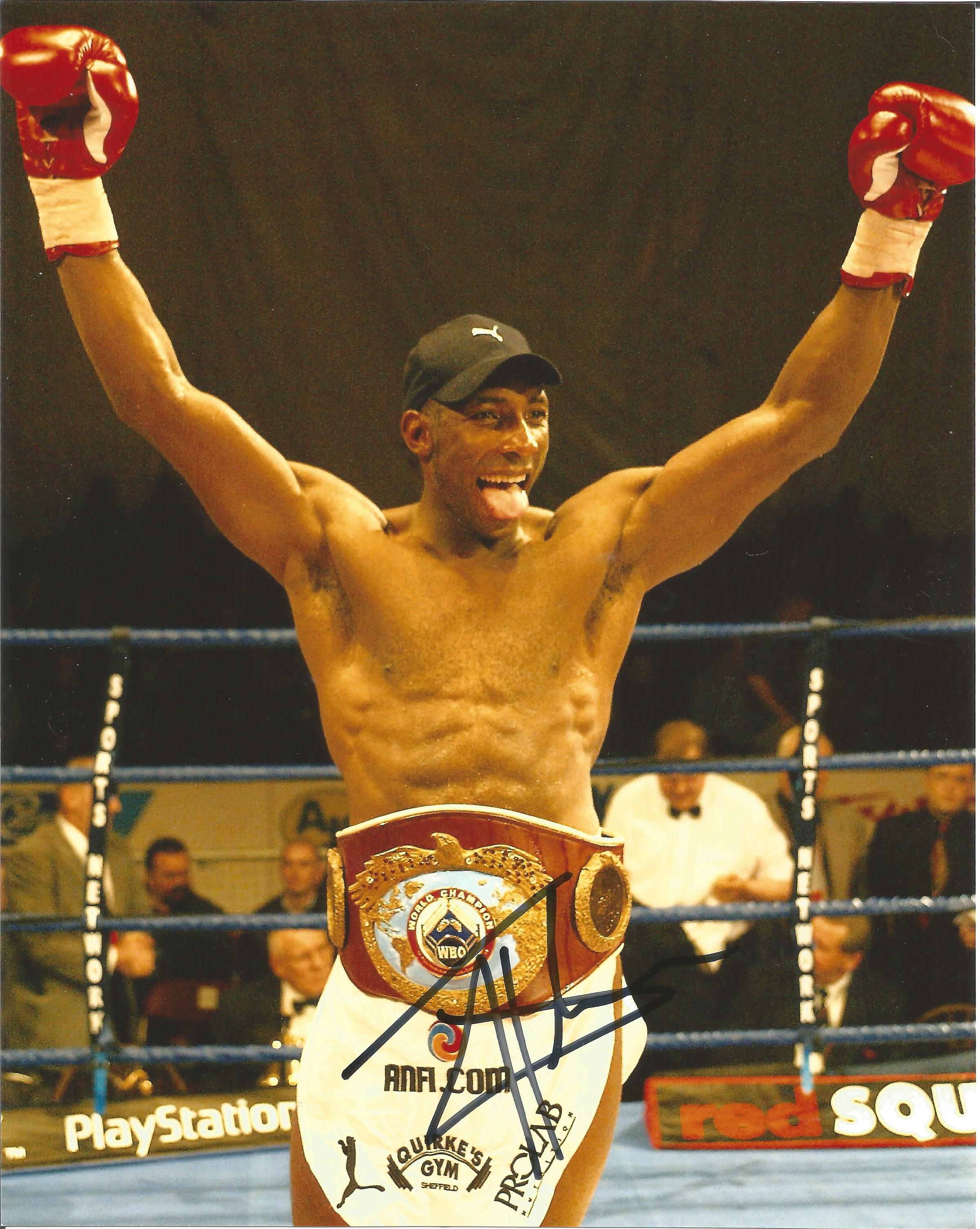 Johnny Nelson signed 10x8 colour photo pictured celebrating after defending his world