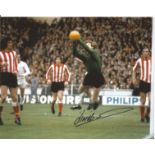 Jim Montgomery signed 8x10 colour photo pictured playing for Sunderland against Leeds United in 1974