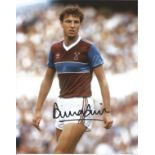 Alvin Martin signed 10x8 colour photo pictured in action for West Ham United. Good Condition. All