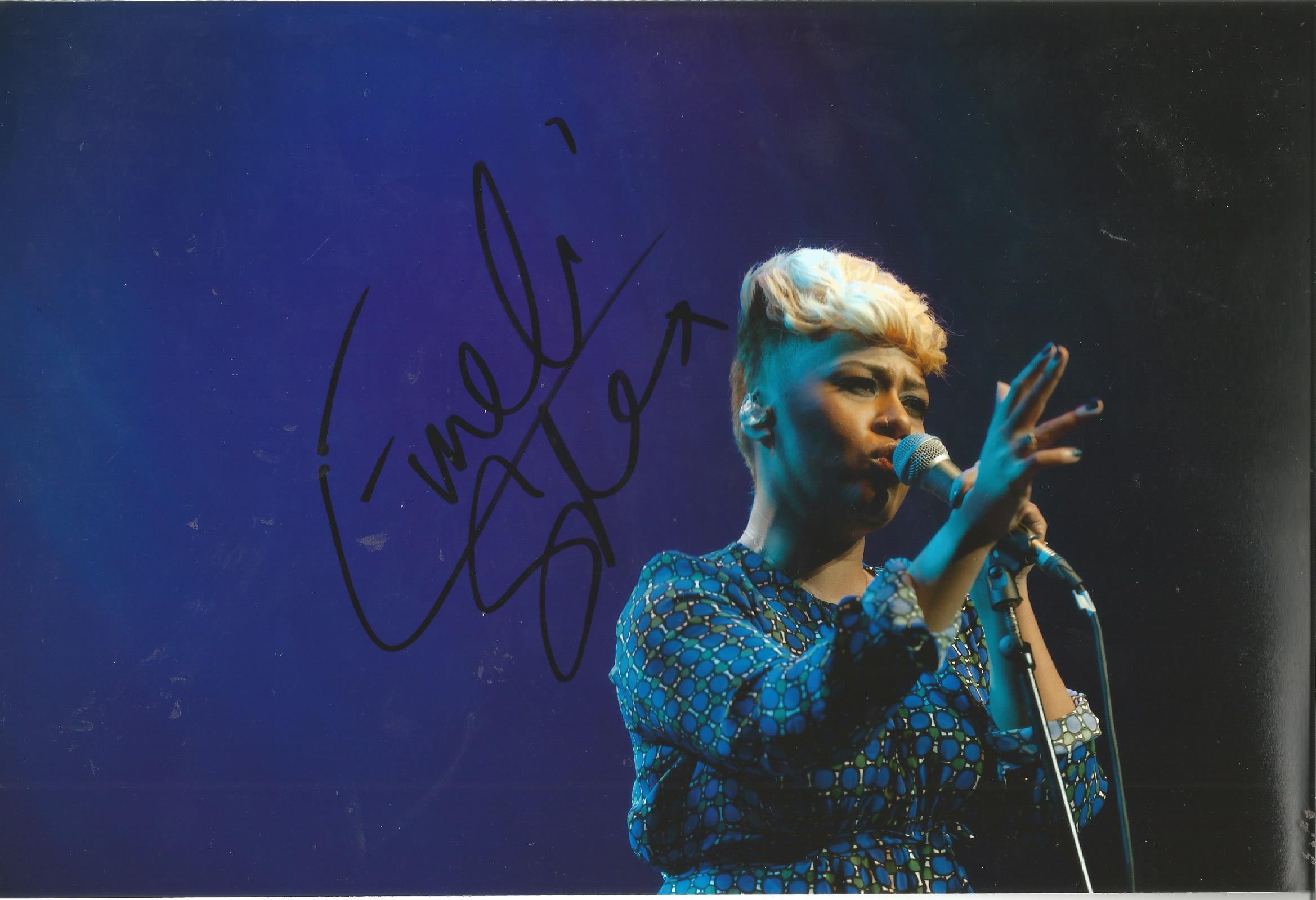 Emeli Sande Singer Signed 8x12 Photo. Good Condition. All signed pieces come with a Certificate of