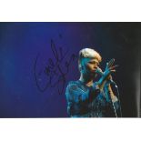 Emeli Sande Singer Signed 8x12 Photo. Good Condition. All signed pieces come with a Certificate of