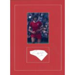 Football Emlyn Hughes small signature piece, mounted below colour photo. Approx overall size