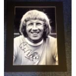 Colin Bell signed b/w photo. Mounted to approx size 20x16. Good Condition. All signed pieces come