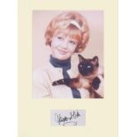 Hayley Mills Signature mounted with 10x8 picture. Professionally mounted to 16 x12. Good