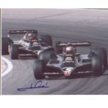 Motor Racing Mario Andretti signed 10 x 8 photo during F1 race. Good Condition. All signed pieces