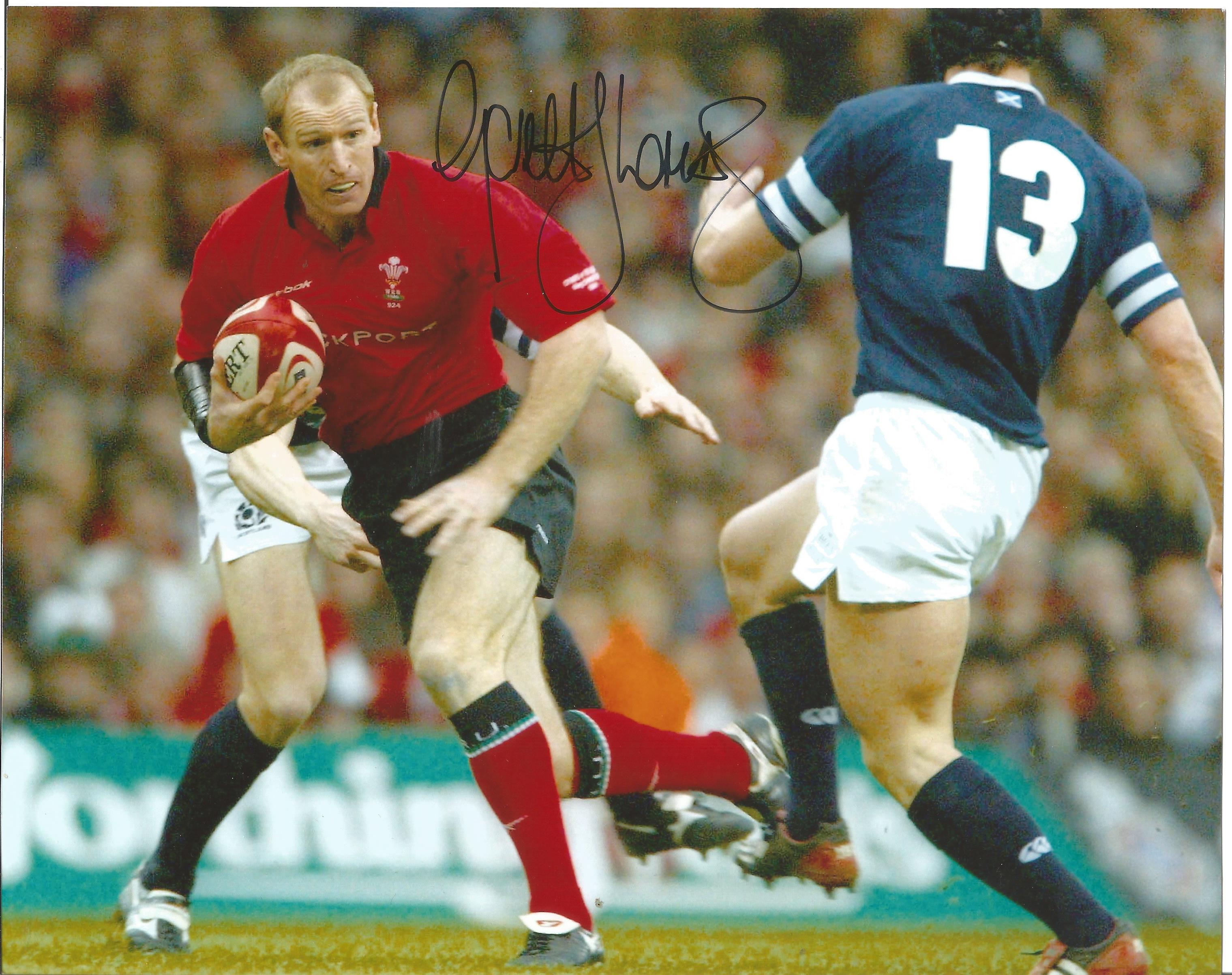 Rugby Union Gareth Thomas 8x10 signed colour photo pictured in action for Wales. Gareth Thomas