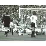 Alan Taylor signed 8x10 b/w football photo pictured scoring for West Ham United against Fulham in