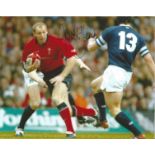 Gareth Thomas signed 8x10 colour photo pictured playing for Wales. Good Condition. All signed pieces