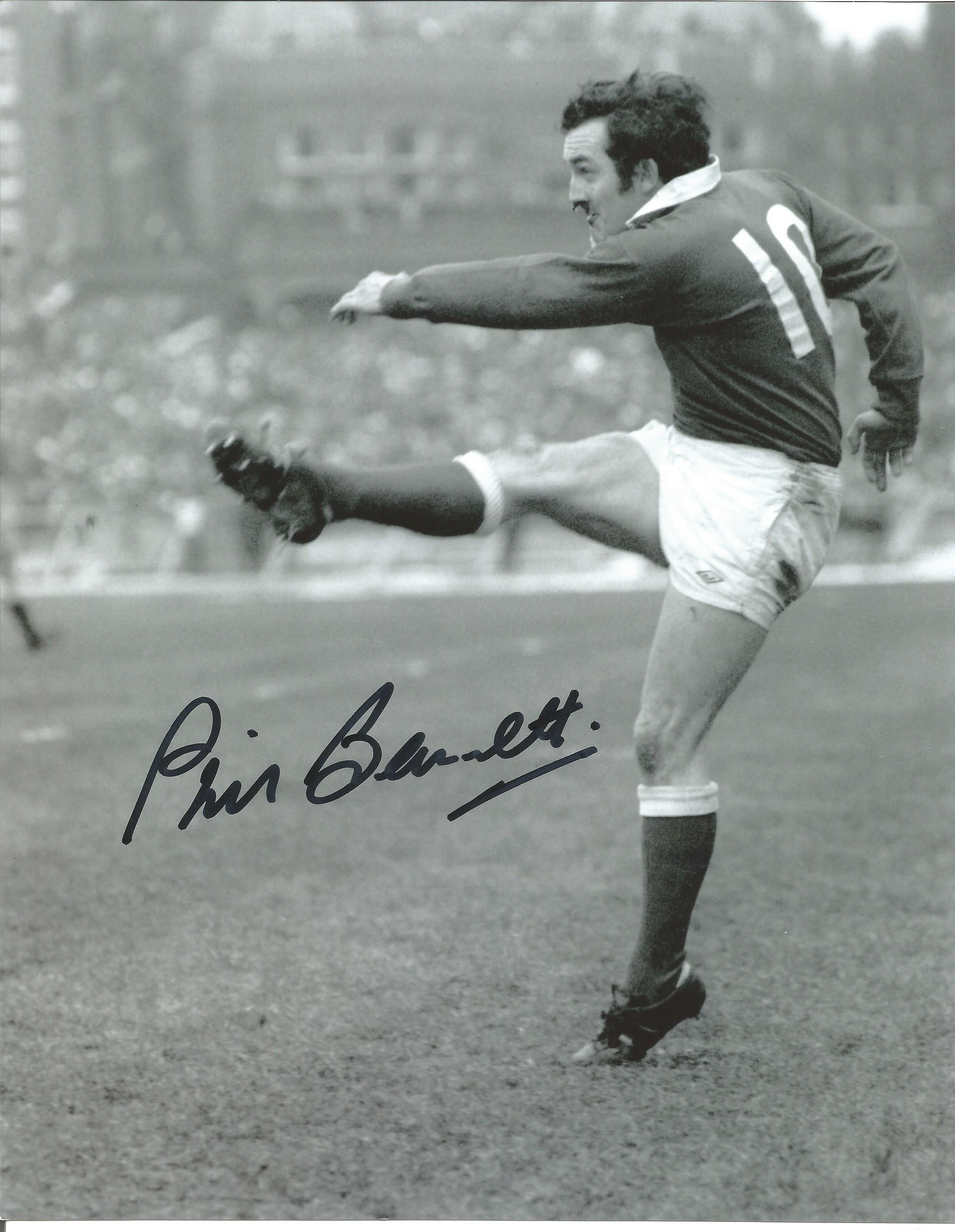 Rugby Phil Bennett signed 10x8 b/w photo pictured in action for Wales. Good Condition. All signed