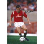 Arthur Albiston signed 12x8 colour football photo pictured in action for Manchester United. Good
