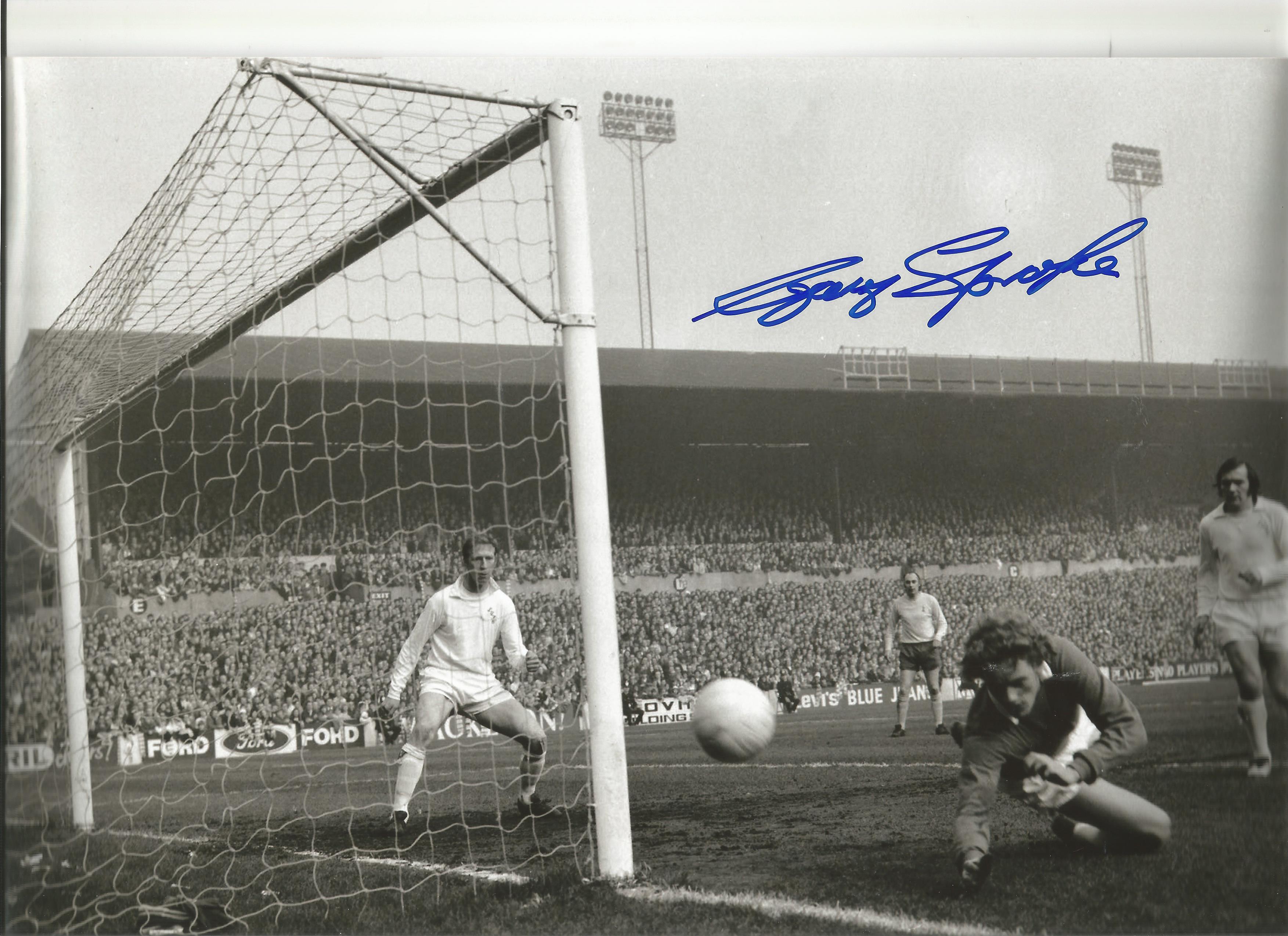 Gary Sprake signed 8x12 b/w football photo pictured in action for Leeds United. Good Condition.