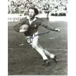 Rugby J.P.R Williams signed 10x8 b/w photo pictured in action for Wales. Good Condition. All