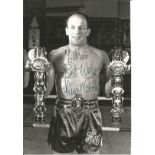 Henry Cooper signed 7x5 black and white photo. Dedicated. Good Condition. All signed pieces come