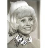 Barbara Windsor signed 12x8 black and white photo from Carry on film. Good Condition. All signed