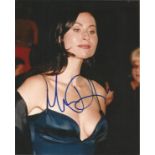 Minnie Driver signed 10x8 colour photo. Few marks to photo but not affecting signature. Good