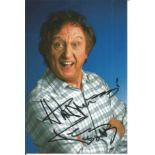 Ken Dodd signed 6x4 colour photo. Good Condition. All signed pieces come with a Certificate of