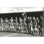 Ron Yeats 12x8 signed b/w football photo pictured celebrating with his Liverpool team mates.
