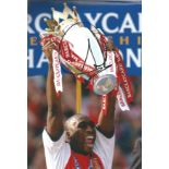 Football Sol Campbell 12x8 signed colour photo pictured lifting the Premier league trophy while