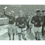 Football Martin Peters 10x8 signed black and white photo pictured celebrating after the 1966 World