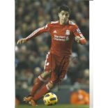 Luis Suárez 12x8 signed colour football photo pictured in action for Liverpool. Good Condition.