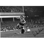 Football Bryan Pop Robson signed 12x16 b/w photo pictured in action for Newcastle United. Good