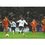 Daniel Sturridge 8x12 signed colour football photo pictured playing for England. Good Condition. All