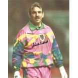 Neville Southall 10x8 signed colour football photo pictured while playing for Wales. Good Condition.