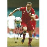 Football Craig Bellamy 12x8 signed colour photo pictured in action for Wales. Good Condition. All