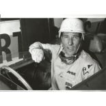 Stirling Moss signed 12x8 black and white photo. Good Condition. All autographs are genuine hand