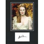 Julianne Moore signature piece mounted below colour photo. Approx overall size 15x12. Good