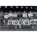 Football Autographed HUGH CURRAN photo, a superb image depicting Norwich City players posing for a