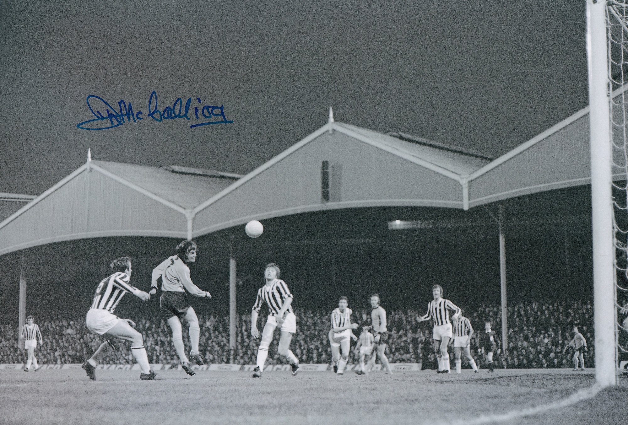 Football Autographed JIM McCALLIOG photo, a superb image depicting the Wolves midfielder sending a