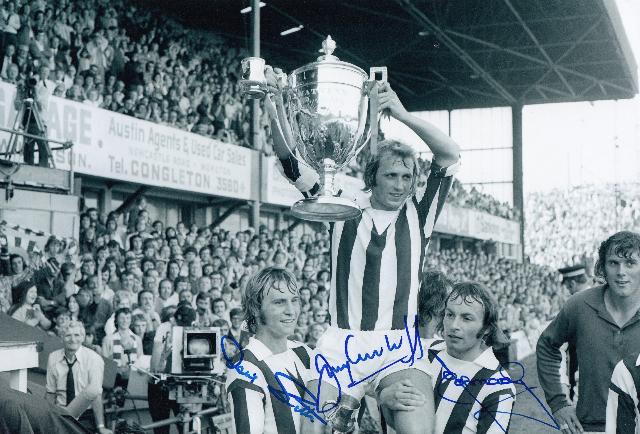 Football Autographed STOKE CITY 1973 photo, a superb image depicting captain JIMMY GREENHOFF holding