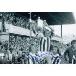 Football Autographed STOKE CITY 1973 photo, a superb image depicting captain JIMMY GREENHOFF holding