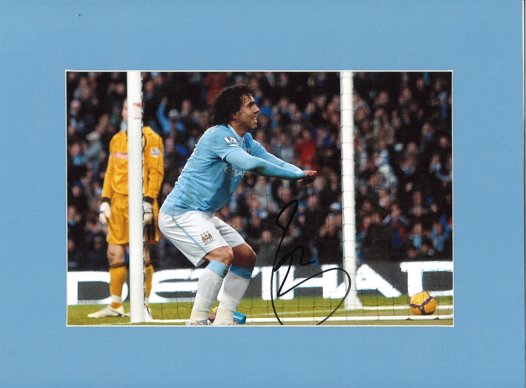 Carlos Tevez signed colour Man City photo. Mounted to approx size 16x12. Good Condition. All