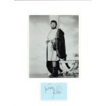 Peter Ustinov signature piece mounted below black and white photo from Quo Vadis. Mounted to