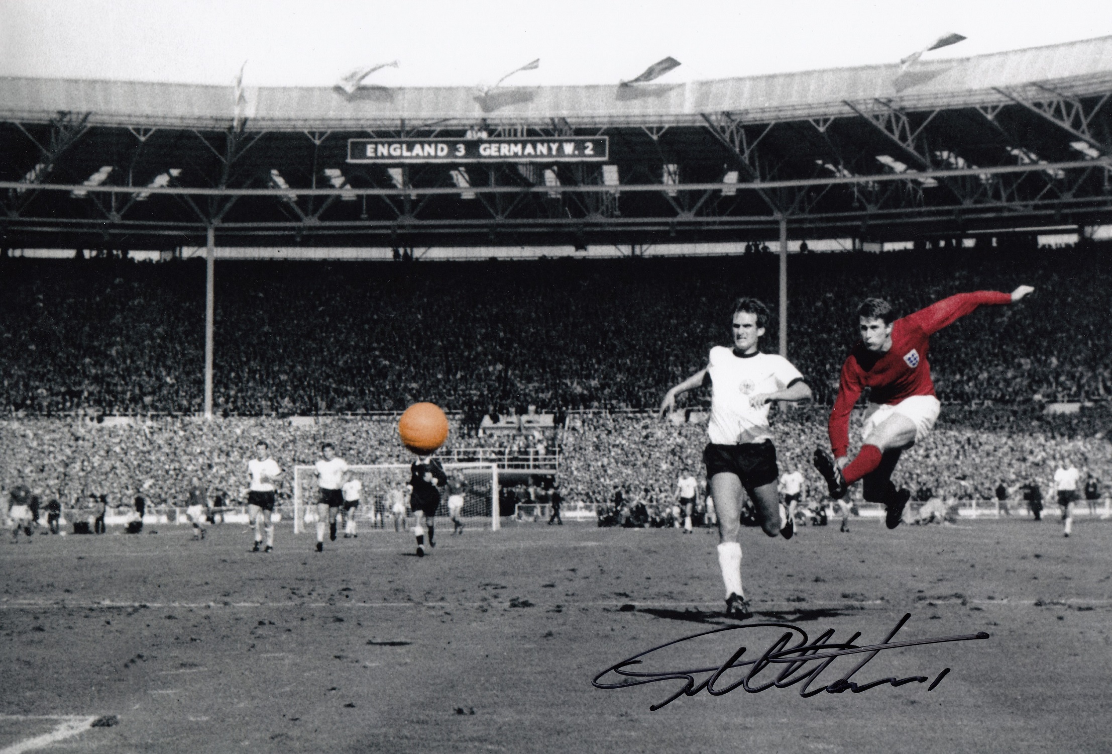 Football Autographed GEOFF HURST photo, a superb image depicting Hurst scoring his third goal and