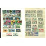 World stamp collection in A5 stock book. 100+ stamps. Including Afghanistan, Malta, India,