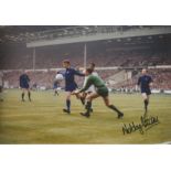 Football Nobby Stiles 8x12 signed colour photo pictured in action fore Manchester United during