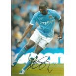 Football Yaya Toure 12x8 signed colour photo pictured in action for Manchester City. Good Condition.