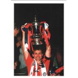 Football Bryan Robson signed 16x12 colour photo pictured lifting the FA Cup while captain of