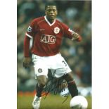 Football Patrice Evra 12x8 signed colour photo pictured in action for Manchester United. Good