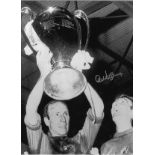 Football Alex Stepney 16x12 signed black and white photo pictured celebrating with Bobby Charlton