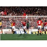 Football Gordon McQueen 12x16 signed colour photo pictured during his time with Manchester United.