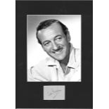 David Niven signature piece mounted below b/w photo. Approx. overall size 16x12. Good Condition. All