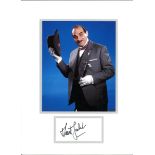 David Suchet signature piece mounted below colour Poirot photo. Approx overall size 16x12. Good