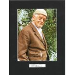 Bill Owen signature piece, mounted below colour photo as Compo from Last of the Summer Wine. Approx.